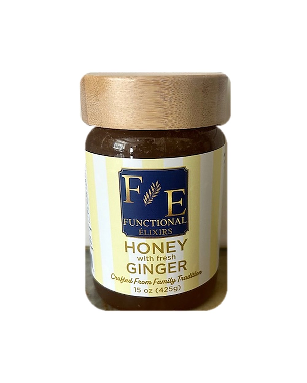 Honey with Fresh Ginger, 15 oz — the jar photographed from a slightly wider angle on a marble counter